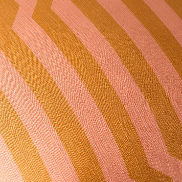 Clay-hued woven textile with graphic stripes, close-up on refined upholstery fabric.