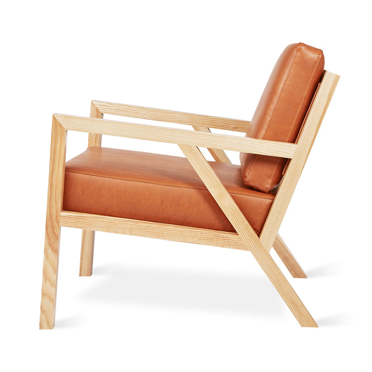 Mid-century modern armchair with oak frame and caramel leather upholstery
