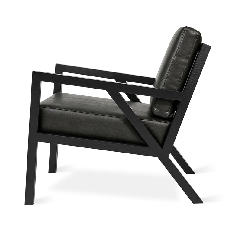 Black leather armchair with geometric wood frame, modern designer furniture