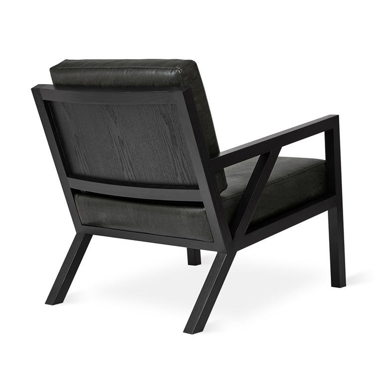 Black leather armchair with dark wood frame, modern designer lounge chair