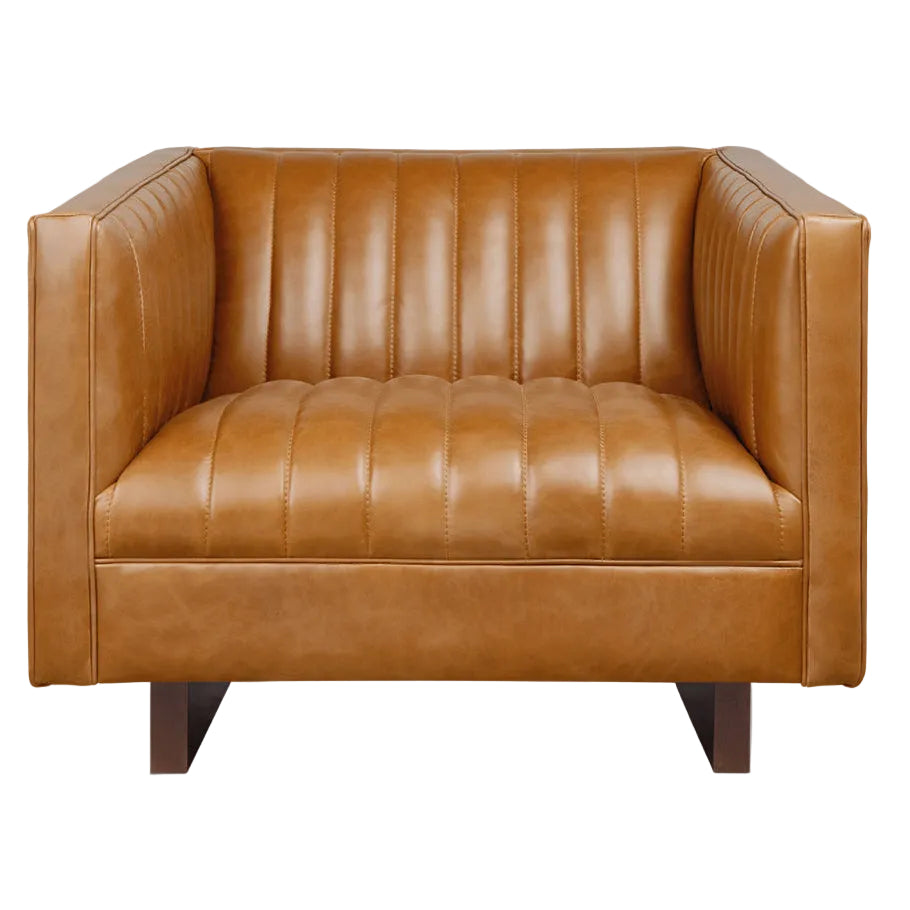Tan leather armchair with vertical channel tufting and dark wood legs