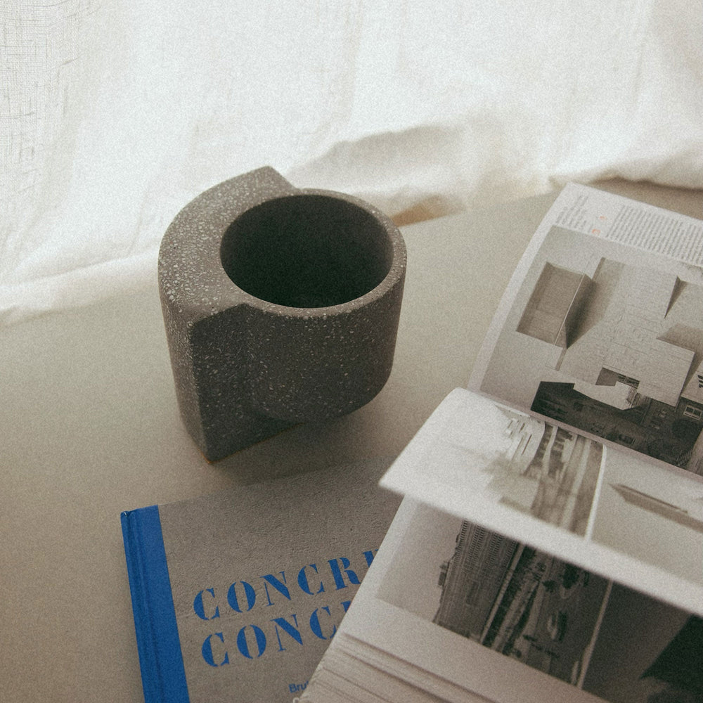 Graphite concrete planter by Kelsey Cherry, modern geometric design on neutral surface