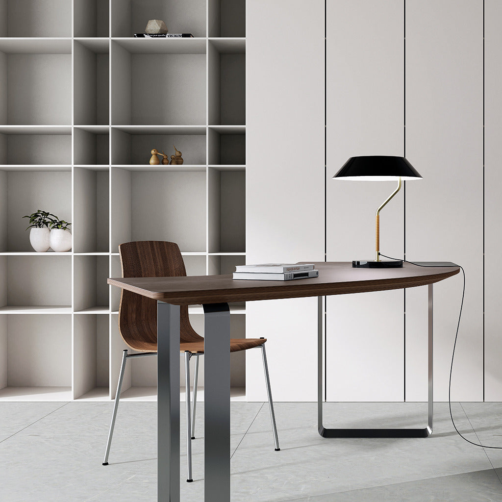 Aider Table Lamp with black shade on a walnut desk in a home office with open white shelving