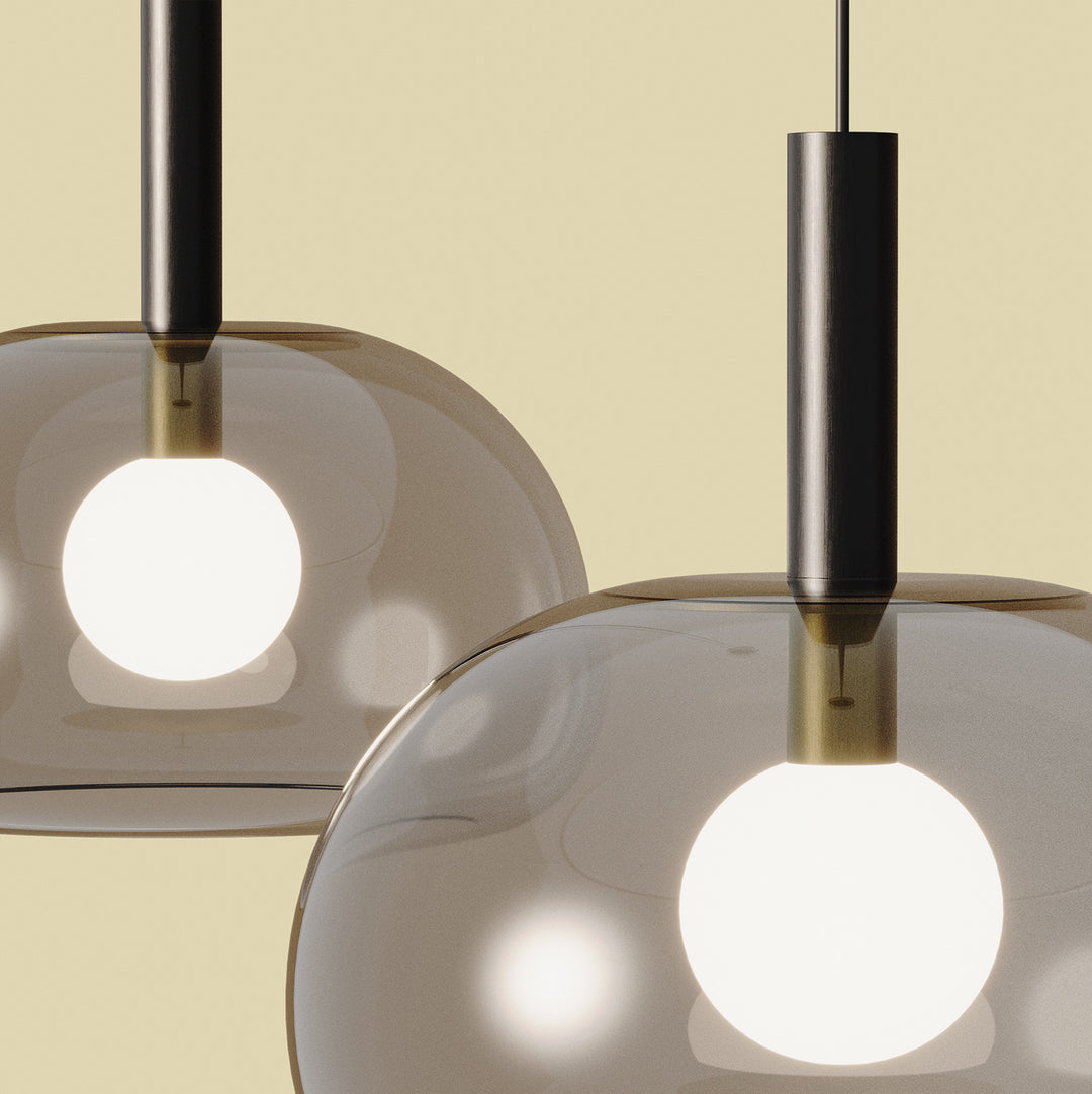 Cloud Single Pendant Lamp close-up of two lit smoked glass domes with dark stems and opal globe bulbs