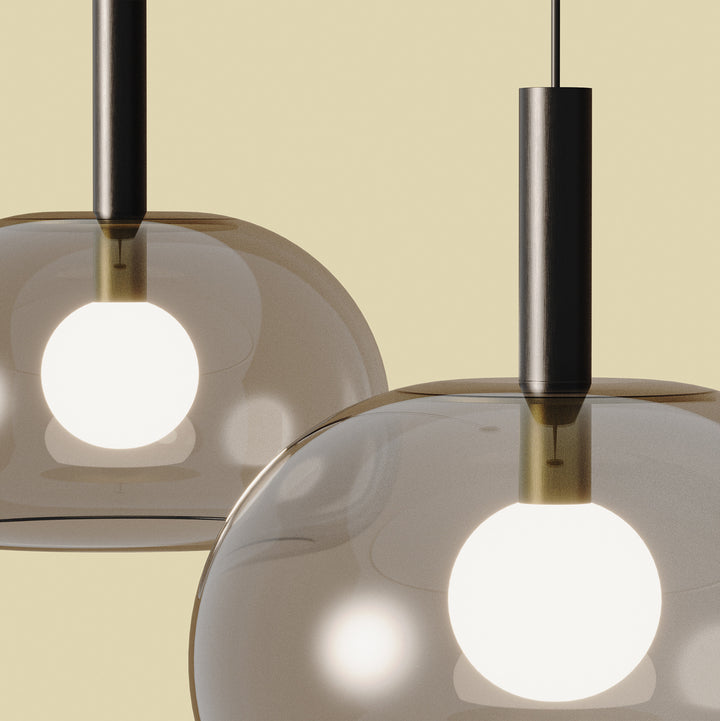 Cloud Single Pendant Lamp close-up of two lit smoked glass domes with dark stems and opal globe bulbs