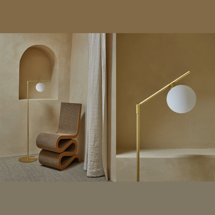 Brass Endo Floor Lamp in an arched alcove next to a wavy cardboard chair, with a close-up of the opal globe