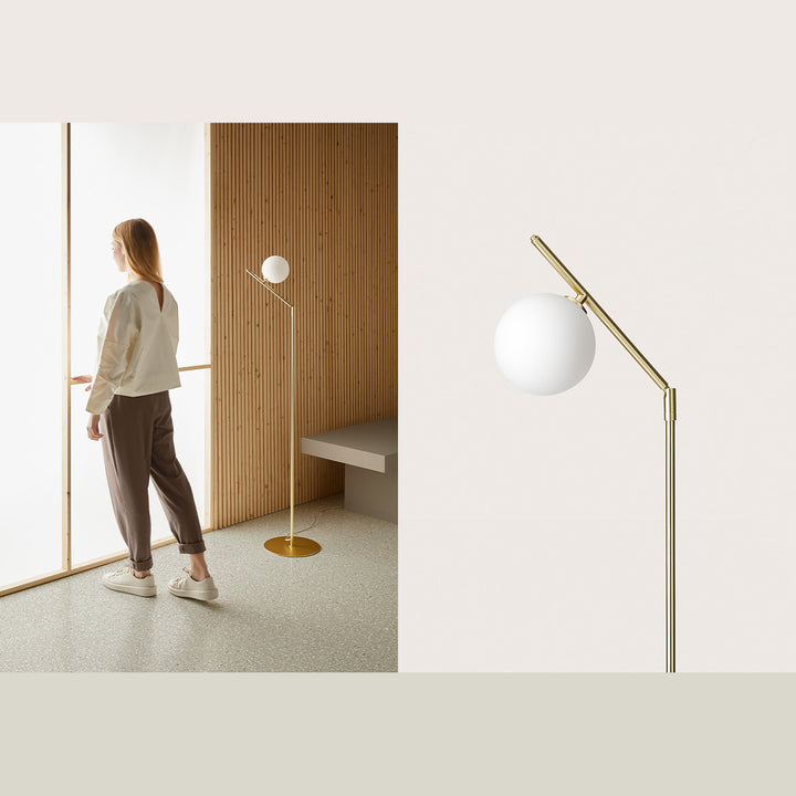 Brass Endo Floor Lamp by a slatted wood wall with a woman at the window, plus a close-up of the globe and arm