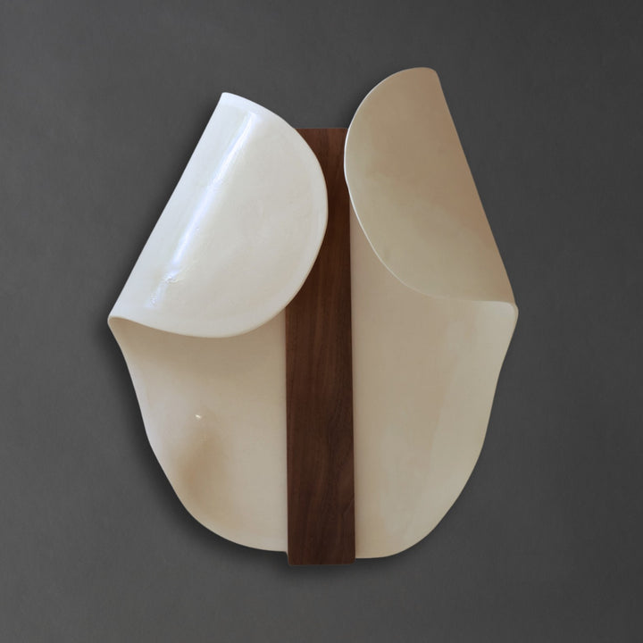 Abundance Duo I wall sculpture, two white stoneware forms around a walnut spine