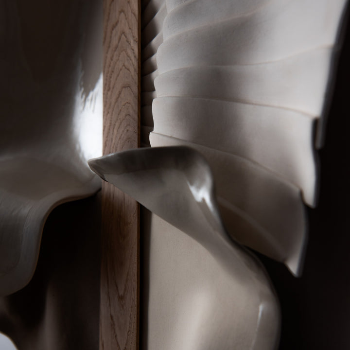 Abundance Large, close-up of the carved white porcelain fan meeting the oak spine
