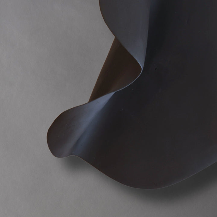 Abundance Small, close-up of the black stoneware curve and shadow