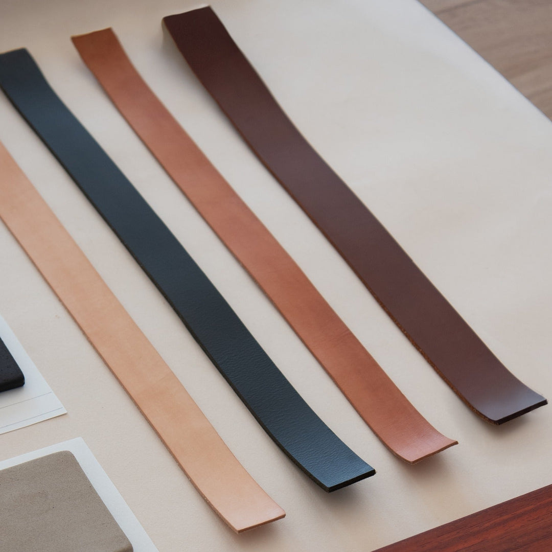 Impermanence Stainless Steel &amp; Leather Floor Light — Black Leather sample, the leather options shown on strips