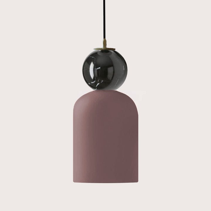 Pendant light with a pink base and black globe on a white background