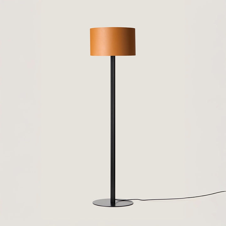 Rems Floor Lamp, orange leather drum shade on a slim matt black stem and round base, by Aromas del Campo