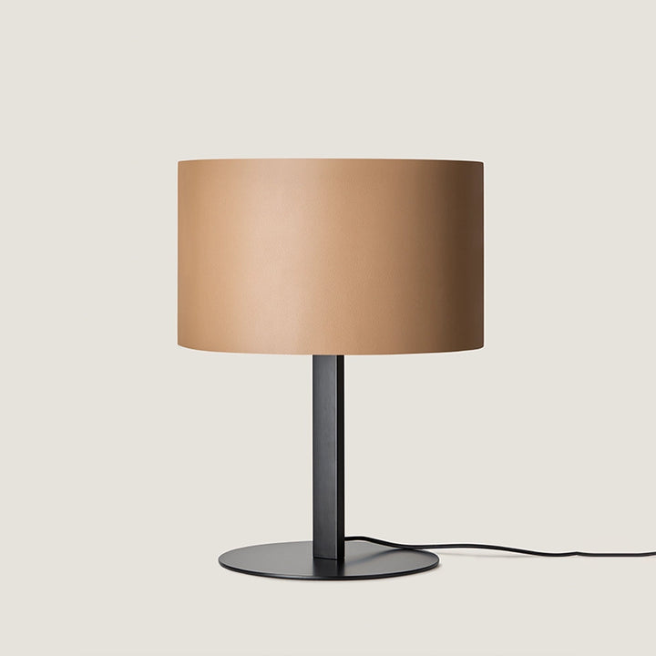 Rems Table Lamp with light tan leather drum shade, black stem and round black base, unlit, by Aromas del Campo