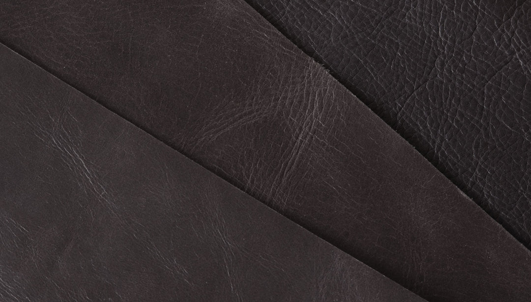 Rich dark leather upholstery with textured grain and elegant stitching detail