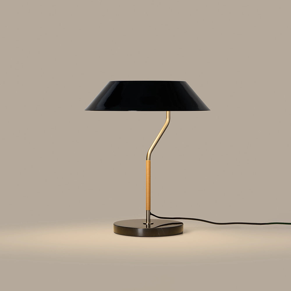 Aider Table Lamp switched on, giving a warm glow