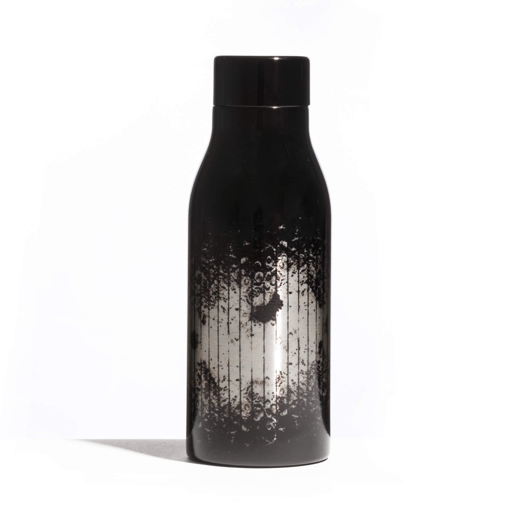 Seletti Cosmic Diner Thermal Bottle Lunar, side angle of the black and silver lunar print