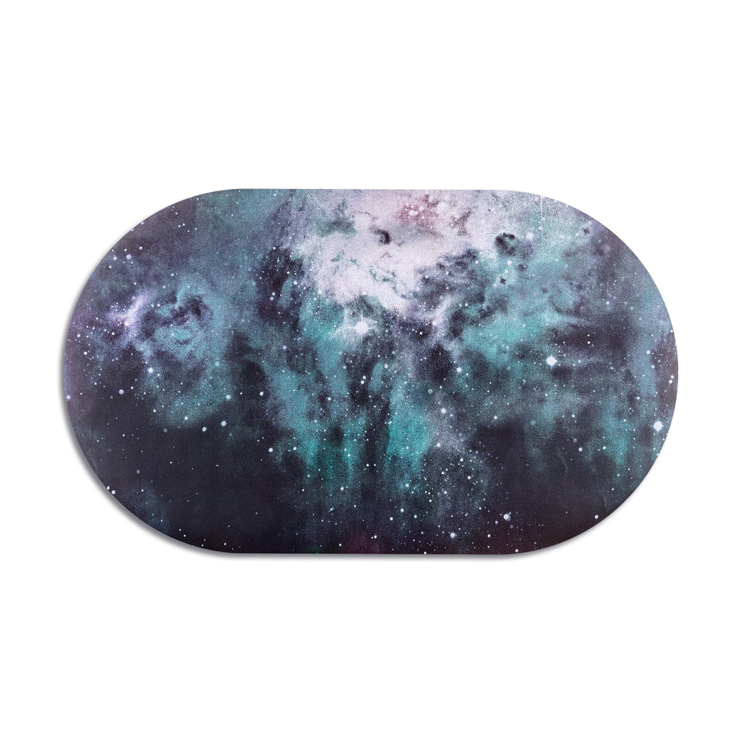 Seletti Cosmic Diner Placemat Nebulosa, oval placemat printed with a teal and violet nebula against black space