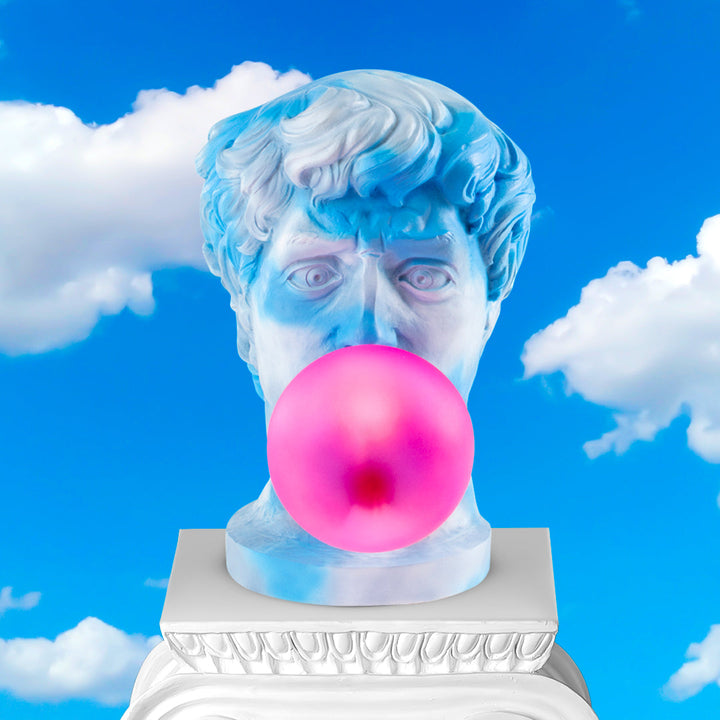 Seletti Wonder Cloud Bust Lamp, the bust on a white plinth against a blue sky with clouds