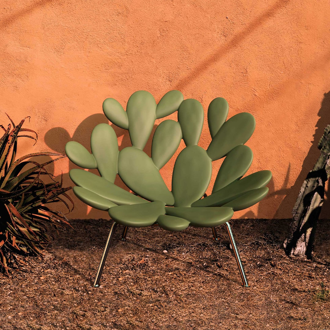 Filicudi armchair by Marcantonio, green polyethylene, sculptural leaf design, outdoor setting