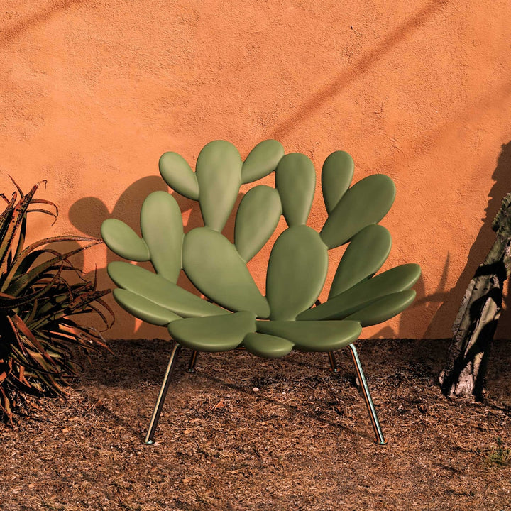 Filicudi armchair by Marcantonio, green polyethylene, sculptural leaf design, outdoor setting