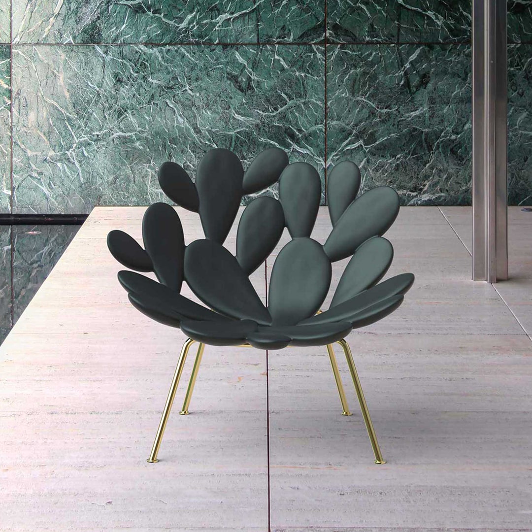 Filicudi armchair by Marcantonio, sculptural green polyethene seat with gold metal legs.
