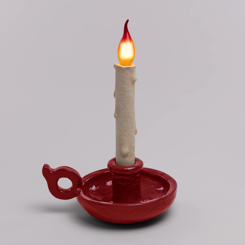 Seletti Bugia LED Candle Lamp Red, deep red base on a gray backdrop, flame lit