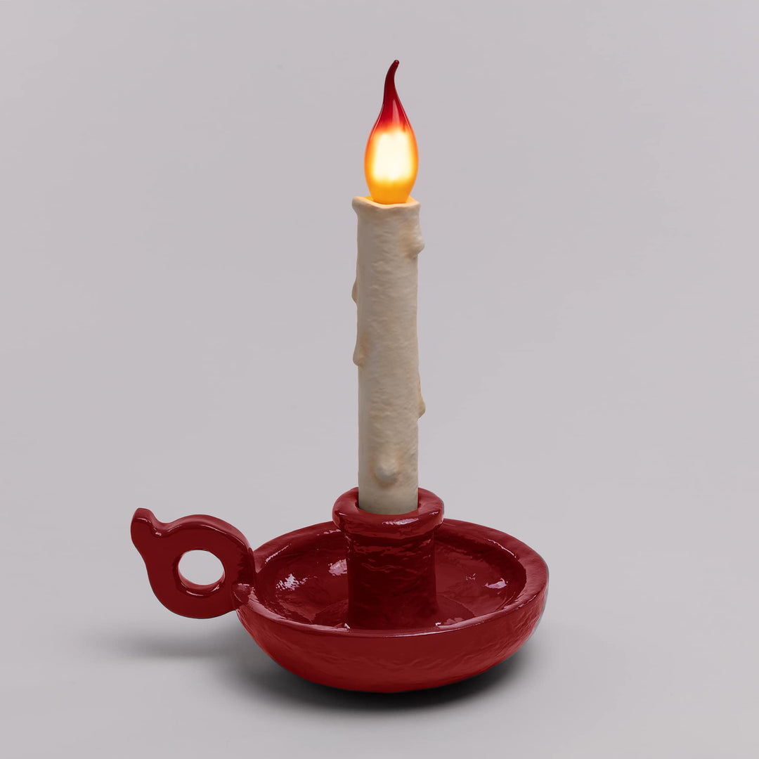 Seletti Bugia LED Candle Lamp Red, deep red base on a gray backdrop, flame lit