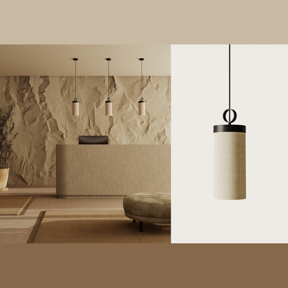 Three Nooi Pendant Lamps hanging over a plaster reception desk against a sculpted stone wall