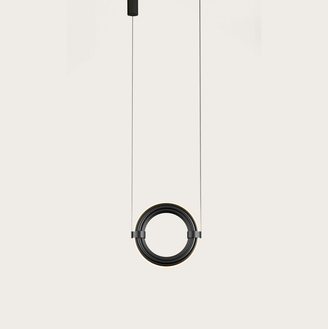 Elli Pendant Lamp in Matt Black, a ribbed ring on two suspension cables with a soft glow, lit