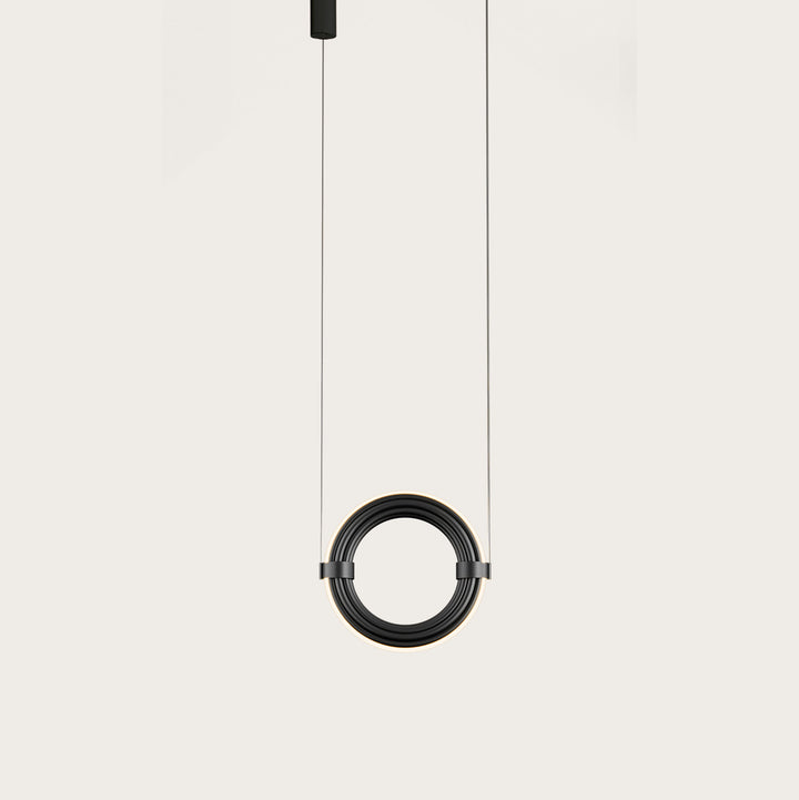 Elli Pendant Lamp in Matt Black, a ribbed ring on two suspension cables with a soft glow, lit