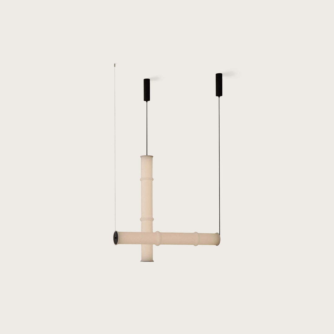 Canna Large Pendant Lamp in a cross-shaped opal tube layout with black canopies and cables, unlit
