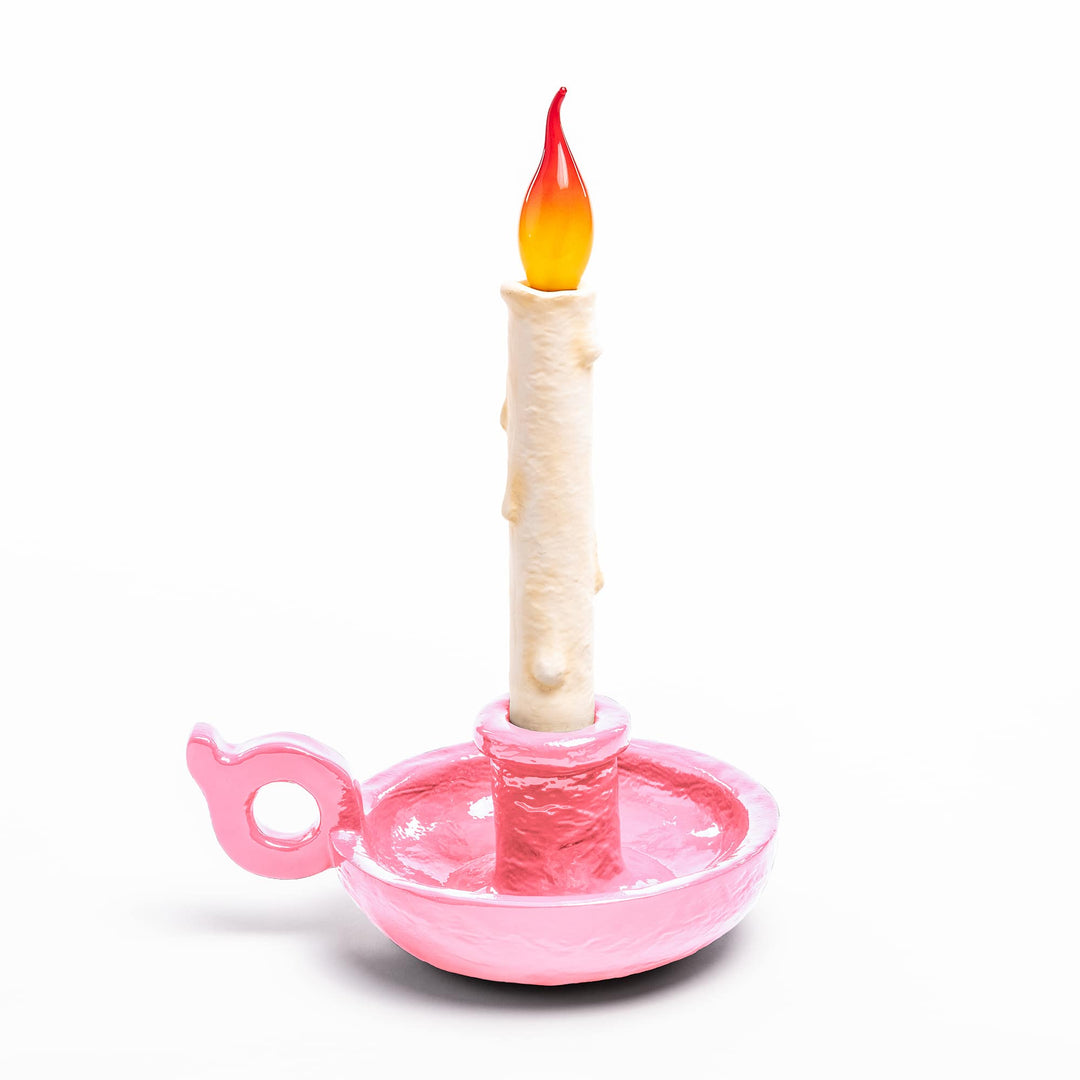 Seletti Bugia LED Candle Lamp Light Pink, pastel pink candleholder base with a white dripping candle and flame tip