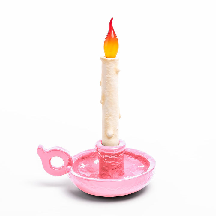Seletti Bugia LED Candle Lamp Light Pink, pastel pink candleholder base with a white dripping candle and flame tip