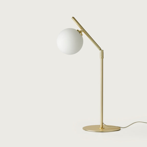 Endo Table Lamp in matt brass with opal glass globe on a slim angled stem, unlit