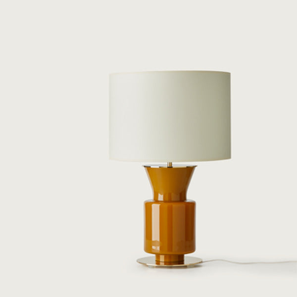Ponn Table Lamp front view with amber glass base and cream drum shade, unlit