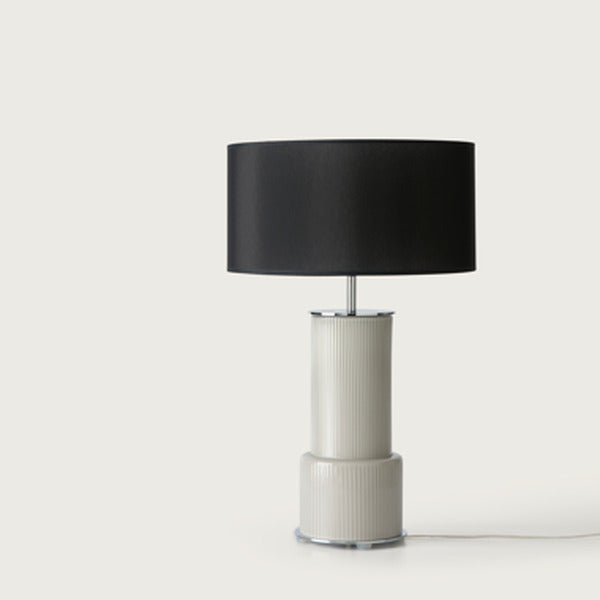 Atina Table Lamp front view with black shade, ribbed grey glass base and chrome disc foot on a light background